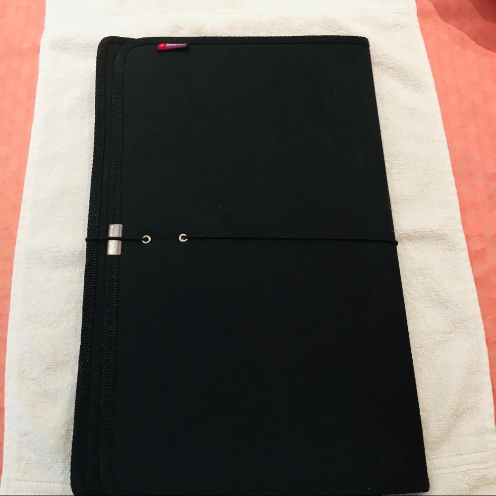 Portfolio legal size in black material. NWOT